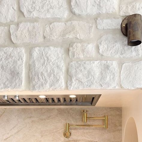 Eldorado Stone on Instagram: "What's for dinner? Does it matter when you're staring at this gorgeous white stone, stainless and brass combo?  Pictured: Loire Valley RoughCut w/ Whitewash Overgrout Technique" Casa Blanca Eldorado Stone, Eldorado Stone, What's For Dinner, Loire Valley, Paint Stain, White Stone, White Wash, Bathroom Remodel, Bathrooms Remodel