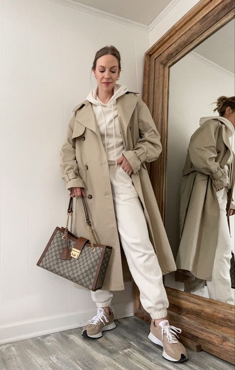 Light brown trench coat styled casually Beige Sweatsuit Outfit, Tracksuit And Coat Outfit, Sweatshirt Trench Coat Outfit, Light Trench Coat Outfit, Light Brown Trench Coat Outfit, Light Brown Coat Outfit, Beige Coat Outfit Classy, Matching Sweatsuit Outfit, Brown Trench Coat Outfit