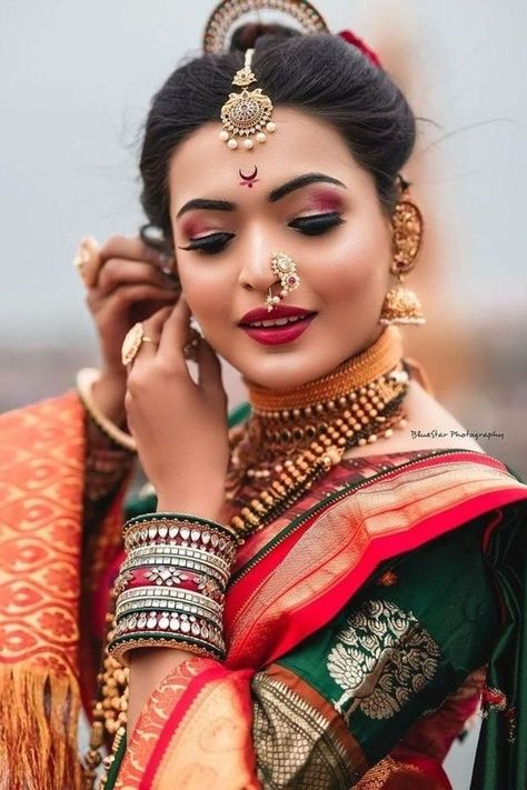 Every bride dreams of having a collection of beautiful wedding sarees that she can wear. Check these outfits out for inspo! Maharashtrian Bridal Poses, Khopa Hair Maharashtrian, Bridal Maharashtrian Look, Marathi Sari Poses, Bride Photoshoot Saree, Marathi Mulgi Look, Maharashtrian Photoshoot, Nauwari Bride Look, Khopa Hair Styles Maharashtrian