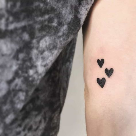 Floating Hearts Tattoo, Small Heart Tattoo Men, Cluster Of Hearts Tattoo, Heart Cluster Tattoo, Filled In Heart Tattoo, Solid Black Heart Tattoo, Black Hearts Tattoo, Small Black Heart Tattoo, Solid Heart Tattoo