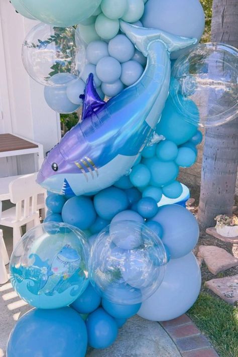 Don't miss this awesome shark-themed birthday party! The balloon decorations are incredible! See more party ideas and share yours at CatchMyParty.com Shark Balloons, Shark Themed Birthday Party Decorations, In Two The Deep Birthday, Shark Party Decor, Shark And Mermaid Birthday Party, Shark Party Decorations, Shark Themed Party, Sea Party Ideas, Ocean Birthday Party