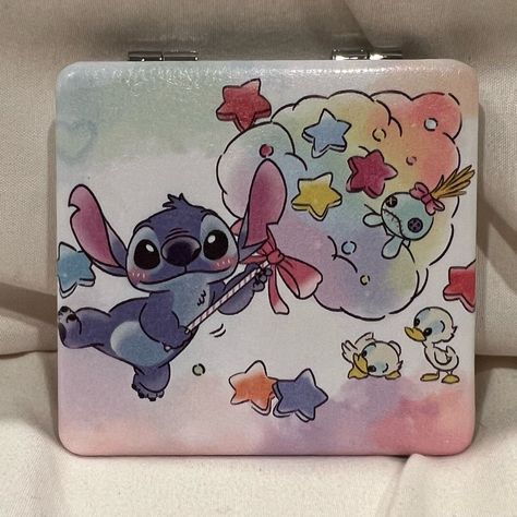 Adorable Double-Sided Portable Compact Mirror. It Has Stitch In A Fun Cotton Candy Theme With Ducks And Scrump On Both Sides So You Always Get To See The Cuteness! One Side Is A Normal Mirror And The Other Is Magnified Which Is A Great Feature! Perfect Little Mirror For Your Purse, Pocket, Backpack, Or Even Gift Giving! Merchandise Ships Fast Usually Within A Business Day! Approx: 2.75” X 2.75” Buy With Confidence: Posh Ambassador Long-Time Online Seller Top-Rated Seller Fast Shipper Top 10% Sha Stitch Mirror, Stitch And Angel Backpack, Stitch Wallet, Stitch Makeup Brushes, Stitch Purse Disney, Candy Theme, Beauty Tool, Disney Lilo, Compact Mirror