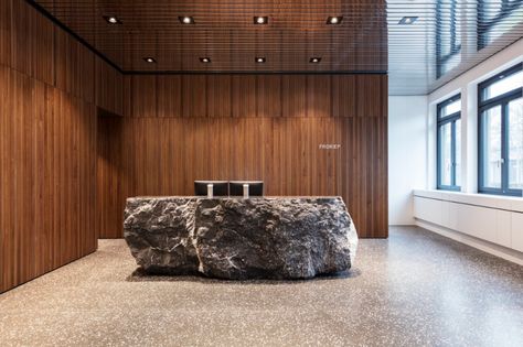 Froriep, law firm | Hürlemann Unique Reception Desks, Stone Reception Desk, Lobby Desks, Hotel Reception Desk, Stone Wall Design, Reception Desk Design, Stone Counters, Reception Counter, Lighting Plan