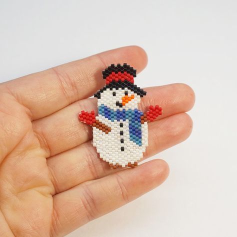 Cute snowman design #13 by Galiga Craft delightful christmas decorations, pendants, medallions, bag charms, earrings, brooches, hair accessories, bookmarks, greeting cards, pet collar charms, or any other accessory you can envision using this patternPlease note that this pattern is designed for those with prior experience in these techniques,including knowledge of increasing and decreasing stitchesPDF file includes:1. Large picture of the pattern2. Bead Legend with the color, name, number and quantity of beads.3. Bead graph - color coded and numbered graph of the pattern.This product includes digital pattern in PDF format that you can instantly download after purchase ✔Please note! That pattern doesn't contain materials and instuctions for beading techniques ✔Technique: Brick StitchColors: Beaded Snowflake Earrings, Beaded Holiday Ornaments, Xmas Beads, Pet Collar Charms, Beaded Snowflakes, Beaded Earrings Tutorials, Brick Stitch Pattern, Beading Techniques, Christmas Bead