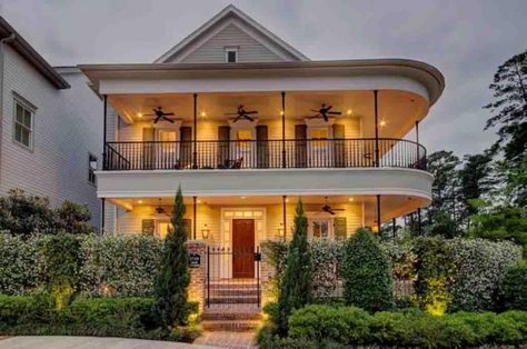 The curved roof-line and porch on this home found on housley.com reminds me of buildings in the French Quarter of New Orleans. It is a gorgeous and inviting outdoor space. #secondstoryporch #porchdesignideas #wraparoundporch #outdoorspaces Double Porch House, Houses With Wrap Around Porches, Charlie Wright, Homes With Wrap Around Porches, Wrap Around Porches, Shipping Container Home Builders, Fabulous Homes, Prefab Container Homes, Container Homes For Sale