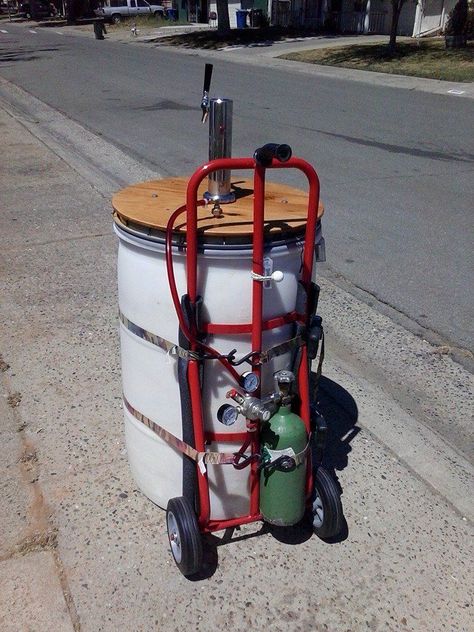 I purchased a kegerator last year to enjoy cold beer on tap at home. Early this spring, I thought that it would be nice to make it portable for camping, parties, fishing trips, etc. After thinking a bit about hauling a refrigerator around (not to mention the need for electricity) I decided to build a large portable cooler designed to hold the keg and CO2 canister. I considered constructing a jockey box but that got trumped by wanting a more enclosed system.I looked around online for some idea... Portable Kegerator, Keg Table, Beer Keg Ideas, Tacos To Go, Kegerator Diy, Beer Station, Camping Parties, Cooler Designs, Beer Keg