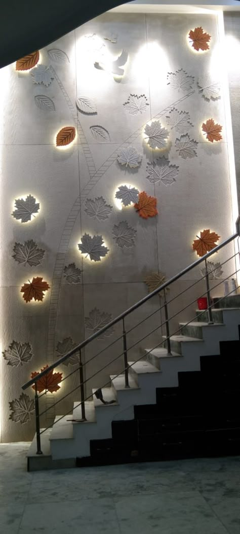 Wall Design For Staircase, Pop 3d Wall Design, Stone Cladding Staircase Wall, Staircase Wall Mural, Duplex Staircase Wall Design Modern, Duplex Stair Wall Design, 3d Mdf Design Wall, Double Height Wall Art, Wall Structure Paint Design For Hall