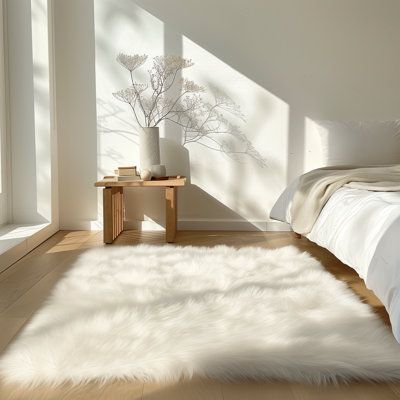 Anchor your room in a warm and soft style with this handmade sheepskin area rug, its unique design, is soft and comfortable, rich in tactile appeal rug distinct to your existing decor for the best visual impact. All of our rugs utilize 100% high grade 2.5" Length artificial wool, this soft faux sheepskin area rug has an extremely smooth touch, and the super soft fuzzy rug adds a touch of elegance to your room, take off your shoes and walk all around the bedroom, living room, feeling the soft, th Fur Rugs Bedroom, White Rug Bedroom Aesthetic, Fuzzy Rug Bedroom, Cute White Room, Spiritual Apartment, Faux Fur Rug Living Room, Fur Carpet Bedroom, Fluffy Rug Bedroom, White Fluffy Carpet