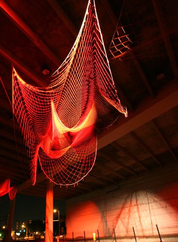 Line Drawing, fishing net sculpture in Tampa, Florida, by Janet Echelman Fishing Net Art, Suspended Net, Decorative Fishing Net, Net Architecture, Fisherman Throwing Net, Net Sculpture, Fish Net Decor, Janet Echelman, School Of Fish Art Installation