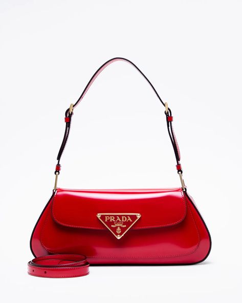 Prada Brushed Leather Curved Shoulder Bag | Vivrelle Prada Red, Prada Leather, Pretty Bags, Triangle Logo, Designer Shoulder Bags, Oui Oui, Metal Plaque, Metal Hardware, Prada Bag