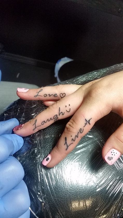 #live #laugh #love #finger #tattoo #studio13tattoomg Live Love Laugh Tattoo, Live Laugh Love Tattoo, Laugh Tattoo, Love Finger Tattoo, Girl Rib Tattoos, Peace Tattoos, Ring Finger Tattoos, Writing Tattoos, Tattoo Signs