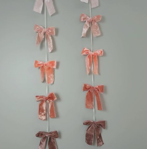 "Soft velvet bow streamers is perfect decor for a nursery or any girl's room and gives any space a soft, romantic, girly feel. Approximate bow measurements: Bow 4\" Tail 4\" Length: 4.5ft; 138cm (6 bows per strand) Bows are threaded onto 1/8\" satin ribbon.  Never leave a child unattended with garland. Not a toy or intended for children. Every garland is hand made specifically for you, so you might experience slight variations in colors, measurements, or materials.  Follow us on Instagram for exclusive sneak-peaks, order photos, and discount codes!                      https://www.instagram.com/ellieb_official If you have any special requests, reach out. We would be happy to hear from you!" Girly Decorations Party, Cute Garland, Bow Photo Backdrop, Christmas Nursery Decor, Bow Wall, Bow Banner, Bow Bedroom, Bow Backdrop, 1st Birthday Decor