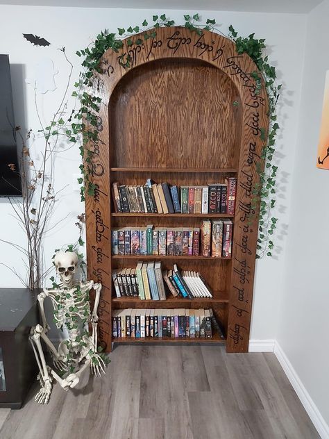 Mines of Moria Entranceway made into a Bookshelf. Genius. Hobbit Bookshelf, Rivendell Inspired Home, Lord Of The Rings Bookshelf, Lord Of The Rings House Decor, Hobbit Aesthetic Home Decor, Lotr Bookshelf, Tavern Basement, Shire Nursery, Hobbit Aesthetic Home