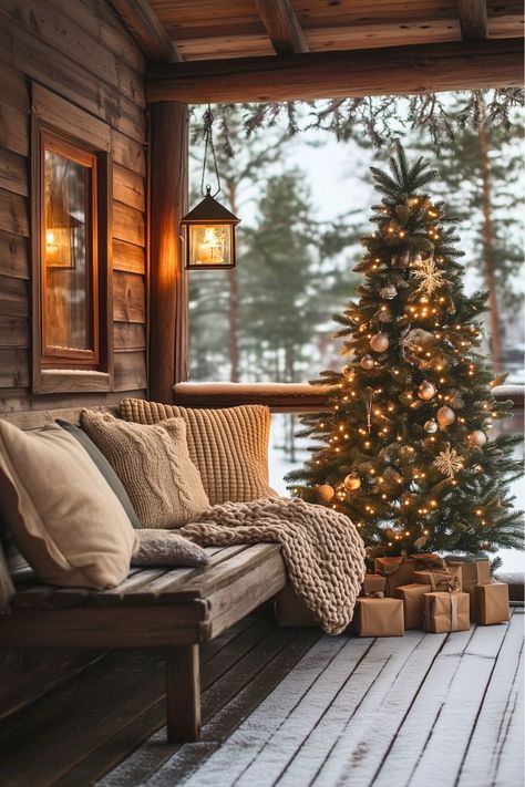 Can a porch feel festive with a calm, neutral vibe? I’d start with rustic lanterns for a warm glow, a throw blanket on a bench, and a vintage Christmas tree surrounded by kraft-wrapped gifts. This understated look blends seamlessly with the cozy charm of a rustic cabin. Ready to create your own serene holiday porch? Check out more ideas to get started! Large Window Christmas Decor, Cozy Cabin Christmas Decor, Window Christmas Decor, Rustic Cabin Christmas, Cozy Cabin Christmas, Cabin Christmas Decor, Cabin Home Decor, Window Christmas, Rustic Porch