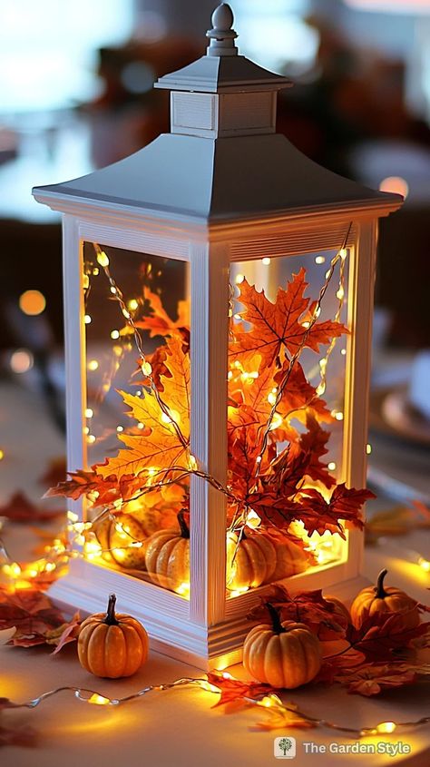 40 Inspiring Fall and Thanksgiving Lantern Decor Ideas You Can DIY - The Garden Style Thanksgiving Lantern, Fall Lantern Centerpieces, Lantern Decor Ideas, Seasonal Centerpieces, String Lights Inside, Mall Ideas, Lantern With Fairy Lights, Fall Lanterns, Fall Lantern