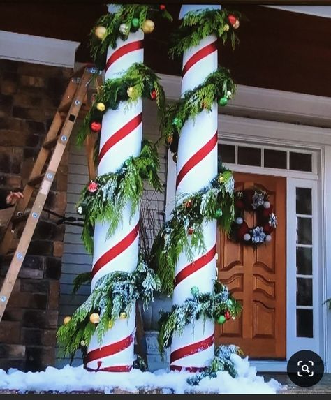 Holiday Column Decorations, Pilar Christmas Decoration, Christmas Pillars Decorating Ideas, Christmas Pole Decorations, Christmas Candy Front Porch, Outdoor Column Decoration Ideas, Candy Cane Porch Pillars, Candy Cane Columns Front Porch, Christmas Decor Garden