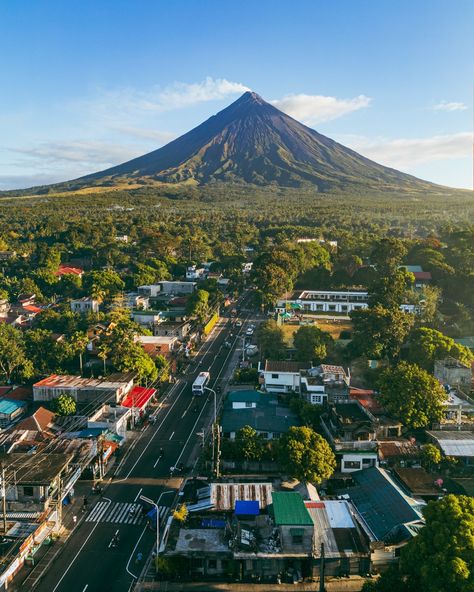 Mount Mayon, located in the province of Albay in the Bicol Region of the Philippines, offers a stunning and iconic view from various vantage points, including Camalig. As you gaze upon this majestic volcano from Camalig, you'll likely see its perfectly symmetrical cone rising dramatically from the surrounding landscape. The volcano's profile is often described as the epitome of beauty and symmetry, making it one of the most picturesque natural landmarks in the Philippines. 📸Junel Mujar #Mo... Beautiful Places In Bicol, Mount Mayon, Albay Philippines, Bicol Region, Datu Puti, Places In The Philippines, Philippines Cities, Regions Of The Philippines, Fairy Life