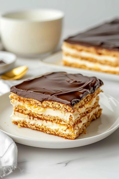 Chocolate Eclair Cake - Insanely Good Vanilla Eclair, Eclair Cake Recipe, Eclair Cake Recipes, Mint Chocolate Cheesecake, Celebrating Sweets, Icebox Cakes, Homemade Vanilla Pudding, Chocolate Eclair Cake, Delish Cakes