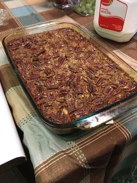 Ingredients 2 rolled refrigerated pie crusts (2 come in a package) 2-1/2 cups brown sugar 1/2 cup butter, melted + 1 Tablespoon 2-1/2 cups light corn syrup 4 teaspoons vanilla extract 6 eggs, beaten lightly 2 cups chopped pecans 1-1/2 cups pecan halves Instructions Preheat oven to 425 degrees (you will lower to 350 degrees after baking the first layer). Grease the bottom of the dish with non-stick spray. I use a 9" x 13" casserole dish. Roll out one pie crust into a rectangular shape and place Pumpkin Pecan Cobbler, Caramel Pecan Pie, Pecan Pie Cobbler, Pecan Cobbler, Best Pecan Pie, Pecan Pies, Easy To Make Desserts, Pecan Pie Recipe, Caramel Pecan