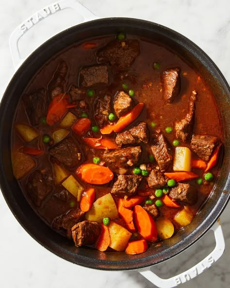 beef stew in a pot on marble Ultimate Beef Stew, Cooking Stew Beef, Best Beef Stew Recipe, Dutch Oven Beef Stew, Homemade Beef Stew Recipes, Best Beef Stew, Oven Beef Stew, Dutch Oven Beef, Sweet Potato Ground Beef