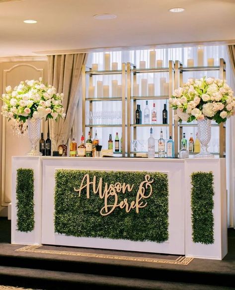 bar inspiration wedding day greenery on the front with couples names and shelves of alcohol behind with big vases and florals Wedding Juice Bar, Wedding Juice, Custom Dance Floor, Wedding Cocktail Bar, Event Venue Design, Mocktail Bar, Mobile Cocktail Bar, Commercial Space Design, Catering Design