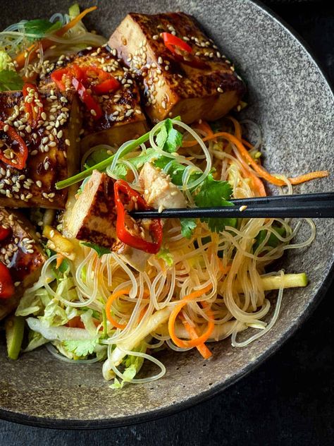 Pan fried sticky tofu topped on a bed of fresh and crunchy glass noodle salad, this is a stunning vegan Asian salad bowl that should top your meal plan every week. Tofu Glass Noodles, Vegan Asian Salad, Chemo Meals, Glass Noodles Recipe, Sticky Tofu, Asian Salad Recipe, Glass Noodle Salad, Noodle Bowls Recipes, Bowls Recipes