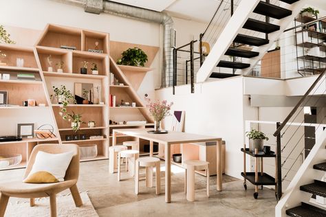 Introducing Hunker House, Our New IRL Space | Hunker Family Room Storage, Functional Entryway, Seventh Heaven, Plywood Shelves, Leather Lounge Chair, Leather Lounge, Polished Concrete, Concrete Floors, Furniture For Small Spaces