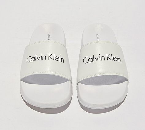 Calvin Klein Womens Linear Slides in White. Sliding into your summer selection with their luxe high end fashion aesthetic. A one piece moulded footbed provides flexible comfort, with a tonal foot strap featuring Calvin Klein branding. High End Fashion Aesthetic, Nike Crocs, Sandals Nike, Summer Footwear, Slider Sandals, Sneakers Addict, Womens Slides, Fashion Aesthetic, High End Fashion