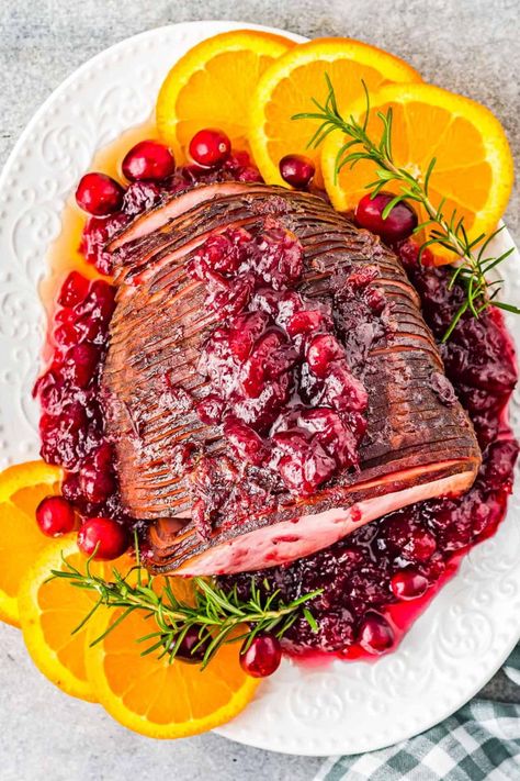 Perfect for Thanksgiving or Christmas, this cranberry glazed ham is so quick and easy to cook in the air fryer. Glazed with cranberry sauce, orange juice and brown sugar, it’s smokey, sweet and tangy. I love cooking up ham during the holidays, it makes for one delicious main dish and the leftovers are always welcomed in the following days. Cooking it in the air fryer is such a simple method to cook your glazed ham perfectly. Ham Air Fryer, Glaze Ham, Holiday Dinner Recipes, Twice Baked Sweet Potatoes, Homemade Fudge Recipes, Ham Glaze Recipe, Thanksgiving 2023, Poppers Recipe, The Cookie Rookie