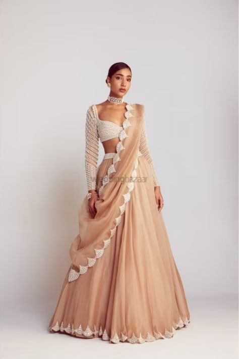 Presenting you latest Indian Engagement Outfit ideas for Bride & Groom. From gowns to simple lehengas, we have got variety of engagement outfits. #weddingbazaar#indianwedding #engagementoutfits #engagementoutfitsindian #engagementoutfitsindiansimple #engagementoutfitsindiangown #engagementoutfitsindiansaree Beige Lehenga, Sweetheart Blouse, Vani Vats, Simple Lehenga, Trendy Outfits Indian, Organza Lehenga, Indian Outfits Lehenga, Lehenga Designs Simple, Pearl Chandelier