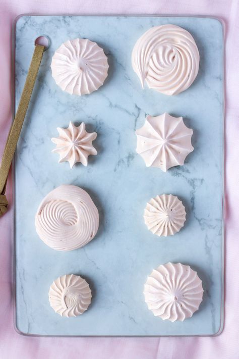 Meringue cookies are not only easy to make, they are also gluten free, fat free, and low calorie! You can pipe the meringue into plops, swirls, rosettes, lollipops, and more. Use the meringues to decorate cakes or enjoy as a small treat! #bakesandblunders #recipe #dessert #fatfree Individual Meringues, Swiss Meringue Cookies, Meringue Cookies Cute Design, Low Calorie Meringue Cookies, Gluten Free Meringue Cookies, Meringue Cookies With Meringue Powder, Low Calorie Meringues, How To Make Meringue, Cookie Party Favors