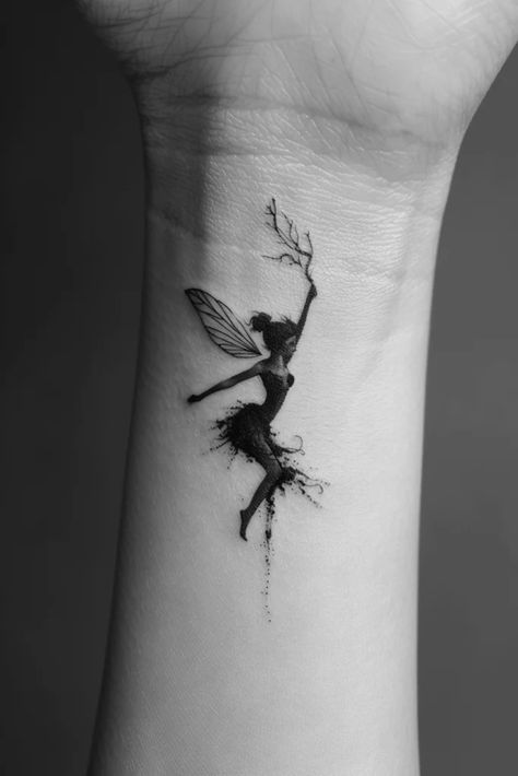 Top 10 Awesome Fairy Tattoo Ideas Dark Tinkerbell Tattoo, Fairy Tattoo Designs Simple, Fairy Wrist Tattoo, Dreams Tattoo Ideas, Fairy Dust Tattoo, Simple Fairy Tattoo, Fairy Tattoos For Women, Silhouette Tattoo Ideas, Fairytale Tattoo Ideas