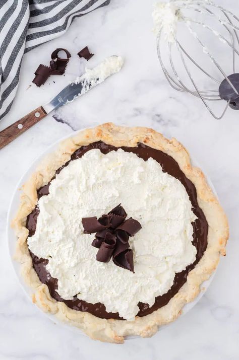 Make a delicious dessert with this chocolate pudding pie with whipped cream topping. Made with simple ingredients, it's an old fashioned classic favorite! Pie With Whipped Cream, Chocolate Pudding Pie, Rolled Sugar Cookie Recipe, Whipped Cream Topping, Chocolate Pie With Pudding, Homemade Chocolate Pudding, Cranberry Scones, Cut Out Cookie Recipe, Pudding Pie