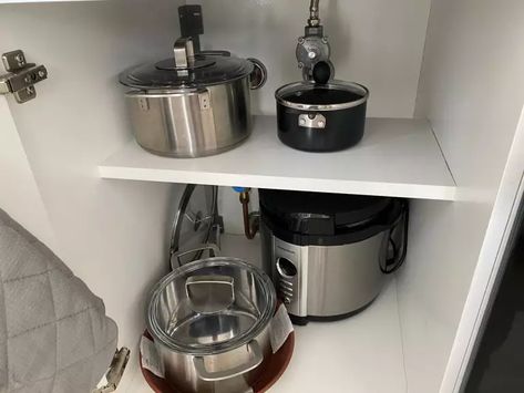 How To Add An Extra Storage Shelf To Your Cluttered Kitchen Cabinet For $2 | The DIY Life Ikea Kitchen Shelves, Ikea Kitchen Drawers, Kitchen Shelf Brackets, Cluttered Kitchen, Kitchen Cabinet Shelves, Kitchen Appliance Storage, Extra Shelf, Inside Cabinets, New Kitchen Cabinets