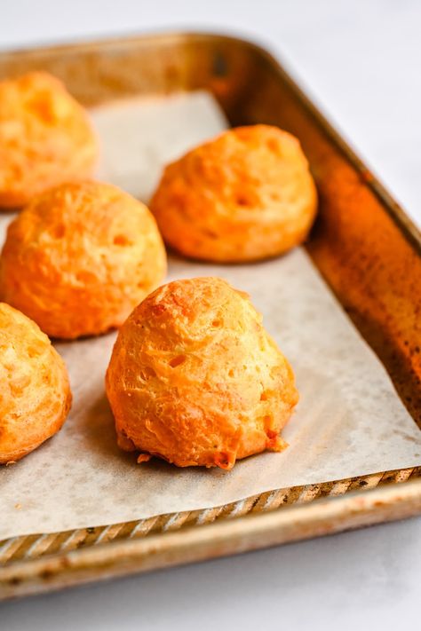 These Cheddar Gougères are essentially French cheese puffs made with choux pastry, and they're absolutely delicious! Crisp on the outside, light, puffed and airy on the inside and perfectly cheesy, these are a lovely appetizer to enjoy with wine or cocktails. French Cheese Puffs, Gougeres Recipe, Choux Puff, Choux Dough, Crowded Kitchen, Outside Light, Cheese Puffs, French Cheese, Mini Sandwiches