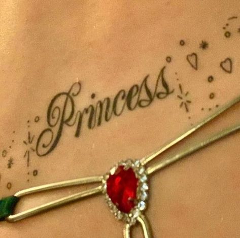 chappell roan's 'princess' tramp stamp tattoo. (via chappell's ig)

february 11th, 2022 Tramp Stamp Tattoos Words, Tramp Stamp Tattoos, Stamp Tattoo, Princess Tattoo, Princess And The Pauper, Tramp Stamp, Pretty Tattoos For Women, Ring Tattoos, American Princess