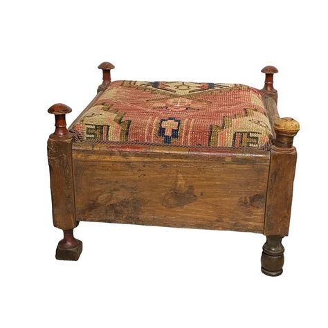 Experience the timeless beauty of India with this Indian Punjabi Square Low Stool. Hand carved from wood and adorned with a hand-knotted antique pinkish Hamadan rug, this stool is a stunning addition to any space. The front is elegantly decorated with high relief brass disks, while the four low wooden legs add a touch of traditional charm. Despite minor loss due to age and use, this stool remains in overall good condition. Dimensions are 19.5"W × 19.5"D × 12"H, making it the perfect piece for any room. Low Stool, Wooden Leg, High Relief, The Four, Timeless Beauty, Hand Knotted, Hand Carved, Carving, Rug