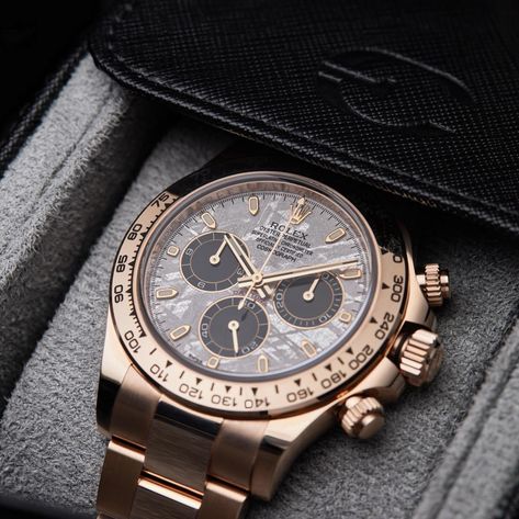 A • UNIQUE • STORY The Rolex Cosmograph Daytona #116505 with a Meteorite Dial is an extraordinary iteration of one of the most iconic and sought-after chronographs in the world. This model elevates the classic Daytona design through the incorporation of a dial made from a genuine meteorite, adding an ethereal beauty and a unique story to each timepiece. The standout feature of this model is undoubtedly its meteorite dial. Meteorite dials are made from slices of iron meteorites that have tr... Rolex Meteorite, Rolex Day Date Meteorite, Gold Rolex Day Date, Rolex Chocolate Dial, Rolex Day Date 36 Yellow Gold, Rolex Cosmograph Daytona, Iron Meteorite, Cosmograph Daytona, Rolex Daytona