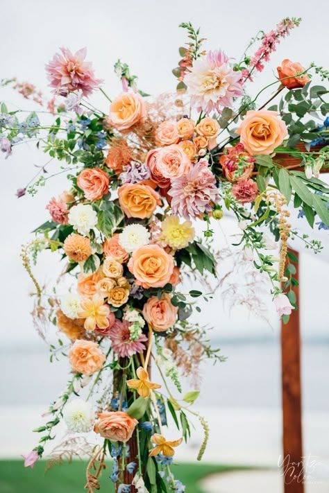 Peach Pink Yellow Wedding Flowers, Spring Wedding Arbor, Yellow And Peach Wedding, Peach Wedding Florals, Peach Flowers Wedding, Wedding Arbor Flowers, Arbor Florals, Wedding Aisle Decorations Outdoor, Pink And Yellow Wedding