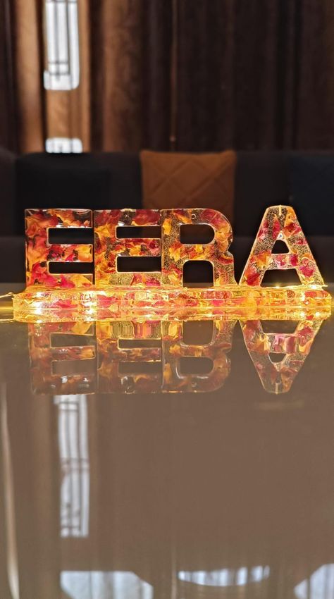 Resin Name stand of name EERA, light name stand, base of 6 inch, 4 letter name stand made from resin, preserving rose petals, led light or fairy light or cork light, Resin Initials stand , alphabet stand, dried rose petal stand of epoxy, epoxy frame, birthday gift ideas, handmade gift ideas, anniversary gift ideas, gift ideas for girlfriend, gift ideas for boyfriend, wedding gift ideas, each letter of 1.5 inch, aesthetic name stand, Simple and easy handmade name stand Resin Name Stand, Birthday Gift Ideas Handmade, Epoxy Frame, Cork Light, Aesthetic Name, Frame Birthday Gift, Gift Ideas Anniversary, Girlfriend Gift Ideas, Frame Birthday