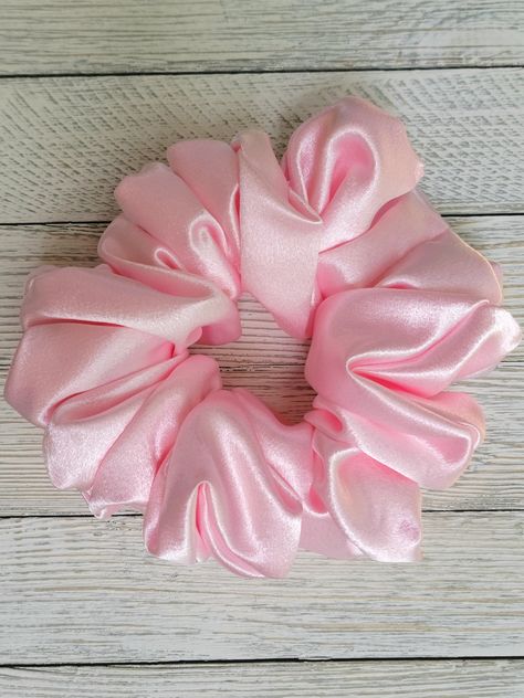 ✨ Introducing the Hana, an elegant Satin Blush Pink Scrunchie ✨ Add a touch of sophistication and charm to your hair accessory collection with our exquisite Satin Blush Pink Scrunchie, the Hana. Perfect for any occasion, this luxurious scrunchie is designed to provide both style and comfort, making it an essential addition to your wardrobe. 🌸 Premium Quality Satin: Crafted from high-quality satin fabric, our scrunchie offers a smooth, glossy finish that adds a touch of elegance to your hairstyle. The gentle material ensures minimal friction, reducing hair breakage and maintaining healthy, shiny locks. 🌸 Blush Pink Color: The soft blush pink hue complements a variety of hair colors and styles, making it a versatile accessory for both casual and formal settings. Whether you're dressing up Prismacolor References, Pink Satin Scrunchie, Pink Scrunchie, Hair Accessories Collection, Sleek Ponytail, Hair Breakage, Satin Color, Gift For Friend, Pink Satin