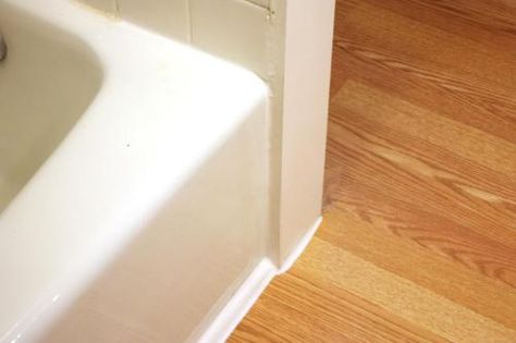 CottageBathroomTrimCaulk Tub Floor Trim, Bathtub Floor Trim, Rustic Remodel, Wood Floor Bathroom, Lodge Ideas, Green Tile Bathroom, Flip Ideas, Baseboard Trim, Handy Man