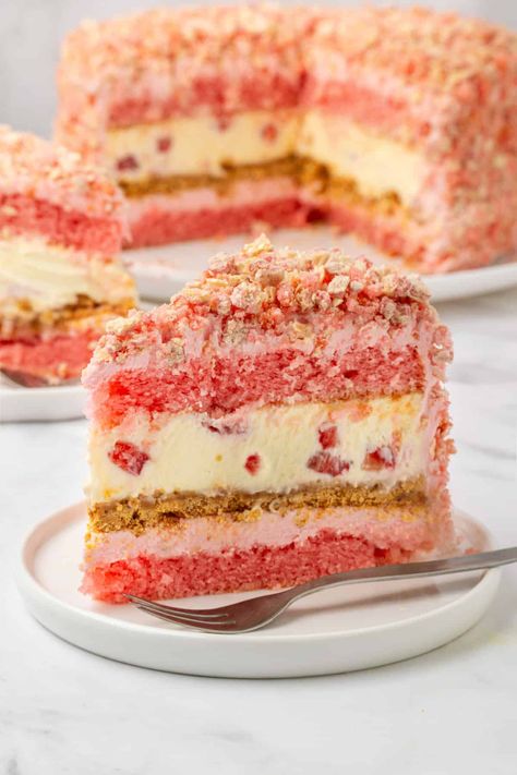 This stunning Strawberry Shortcake Cheesecake recipe features layers of graham cracker crust, no-bake white chocolate cheesecake, and sweet strawberry cake frosting. Then, we top it off with a wafer cookie crumble for flavor and extra crunch! Strawberry Shortcake Cheesecake Recipe, Baked White Chocolate Cheesecake, Strawberry Shortcake Cheesecake, Apple Pie Recipe Easy, Strawberry Waffles, White Chocolate Cheesecake, Strawberry Cake Mix, Strawberry Dessert Recipes, Strawberry Shortcake Recipes