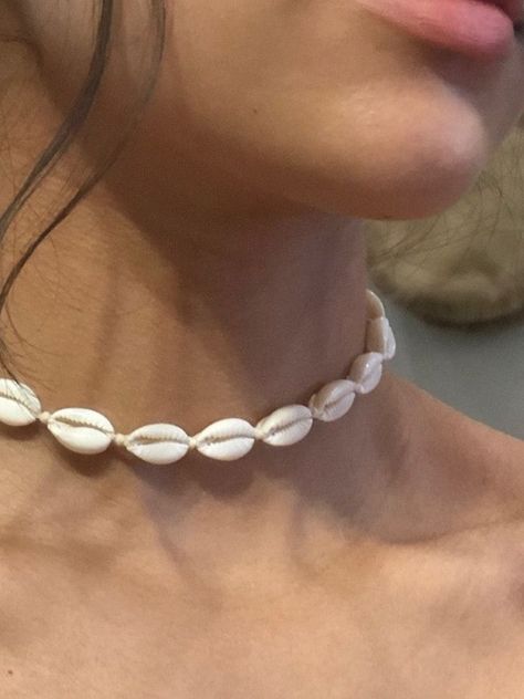 Model wearing white beach shell necklace Cowrie Choker, Cowrie Shell Jewelry, Cork Earrings, Surf Jewelry, Cowrie Shell Necklace, Beach Shells, Shell Choker, Cowrie Shells, Seashell Jewelry