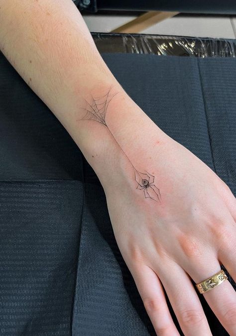 100 Wonderful Spider Tattoos ( The Newest Gallery) - The Trend Scout Spider Web Spine Tattoo, Butterfly With Spider Web Wings Tattoo, Elegant Spider Tattoo, Spider On Back Tattoo, Fineline Spider Tattoo, Hand Tattoo Spider, Abstract Spider Tattoo, Spider Tatoos Woman, Mens Spider Tattoo