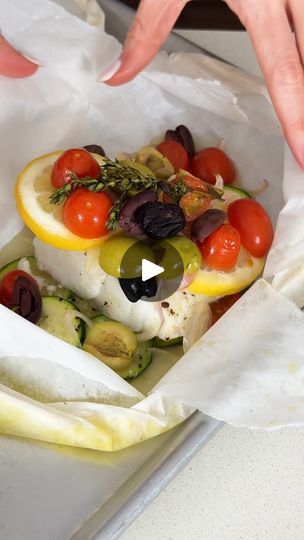 1.9M views · 496 reactions | Mediterranean Cod en Papillote | This Mediterranean cod is the most genius way to quickly achieve a simple, healthy, and super delicious dinner! | By Downshiftology | You guys are going to love this
Mediterranean cod ampapio. Pieces of cod are placed on a
bit of zucchini then topped with sliced lemon, shallot,
grape tomatoes, and olives. A little sprig of fresh thyme and
a drizzle of extra virgin olive oil finishes them off. You'll
seal the parchment paper packets by crimping the edges
and then let the fish steam in the oven for a very quick 15
minutes. Now, trust me, I'm not lying when I say this is one of
these simplest recipes on my website that delivers up a wow
worthy cod dinner. The fish is light, flake and moist and
infused with the best Mediterranean fl Mediterranean Entrees, Cod Dinner, Steamed Cod, Mediterranean Cod, Sliced Lemon, Mediterranean Fish Recipe, Recipes Mediterranean, Low Calorie Breakfast, Mediterranean Diet Plan