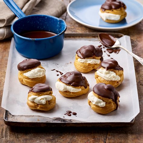 Profiteroles with Chocolate Sauce | Doves Farm | Organic Flours & Foods Flour Alternatives, Baking Essentials, Classic Desserts, Chocolate Sauce, Decadent Chocolate, Food Categories, Eclairs, Baking Flour, Chocolate Treats