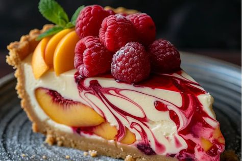 Peach Raspberry Cheesecake Amazing Cheesecake Recipes, Peach And Raspberry Recipes, Peach Raspberry, Fancy Peach Desserts, Raspberry Cheesecake Recipes, Peach Raspberry Cheesecake, Summer Cakes Ideas, Peach And Raspberry Cheesecake, Cheesecake With Peaches