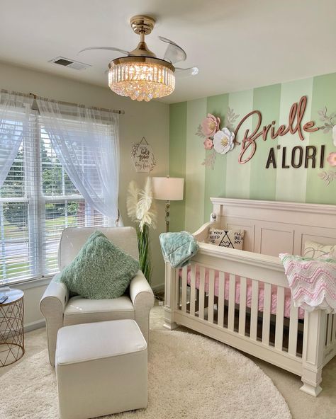 Mint green striped focal wall with name accent. Boho themed nursery decor with a touch of glam. Sage Green And Rose Gold Nursery, Green Nursery Pink Accents, Mint Green Nursery Girl, Pastel Green Nursery, Pink Nursery Colors, Chic Baby Nursery, Boho Themed Nursery, Green Nursery Girl, Nursery Dark Furniture