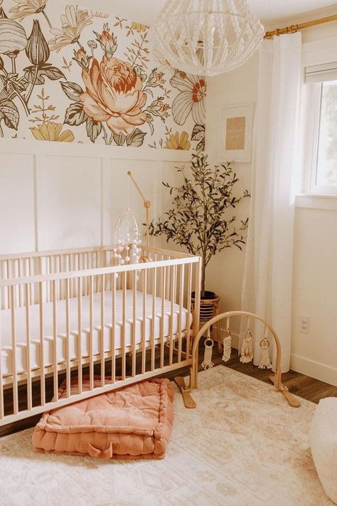 Peach Boho Nursery, Girly Nursery Ideas Boho, Half Wall With Wallpaper, Girly Nursery Ideas Floral, Whimsical Garden Nursery, Baby Girl Forest Nursery, Crib In Corner Of Nursery, Peach Nursery Ideas, Eclectic Nursery Girl